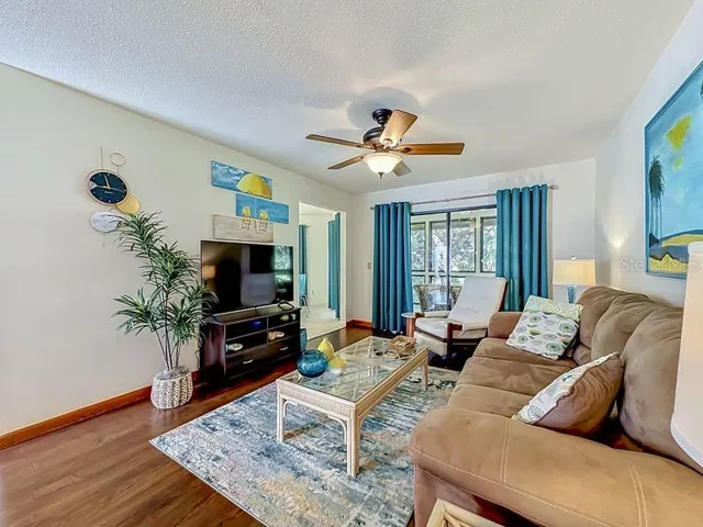 Living Room with view of cafe nook to the left- slider to Florida Room