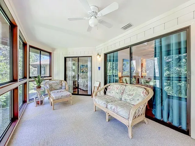Florida Room: Sliders to cafe nook, living room and primary bedroom