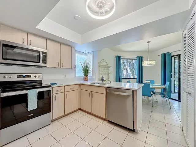 Kitchen Stainless Steel Appliances-Open to Cafe Nook
