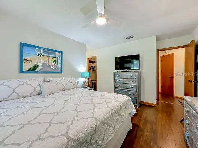 Primary Bedroom: Engineered Wood flooring - view to ensuite bath
