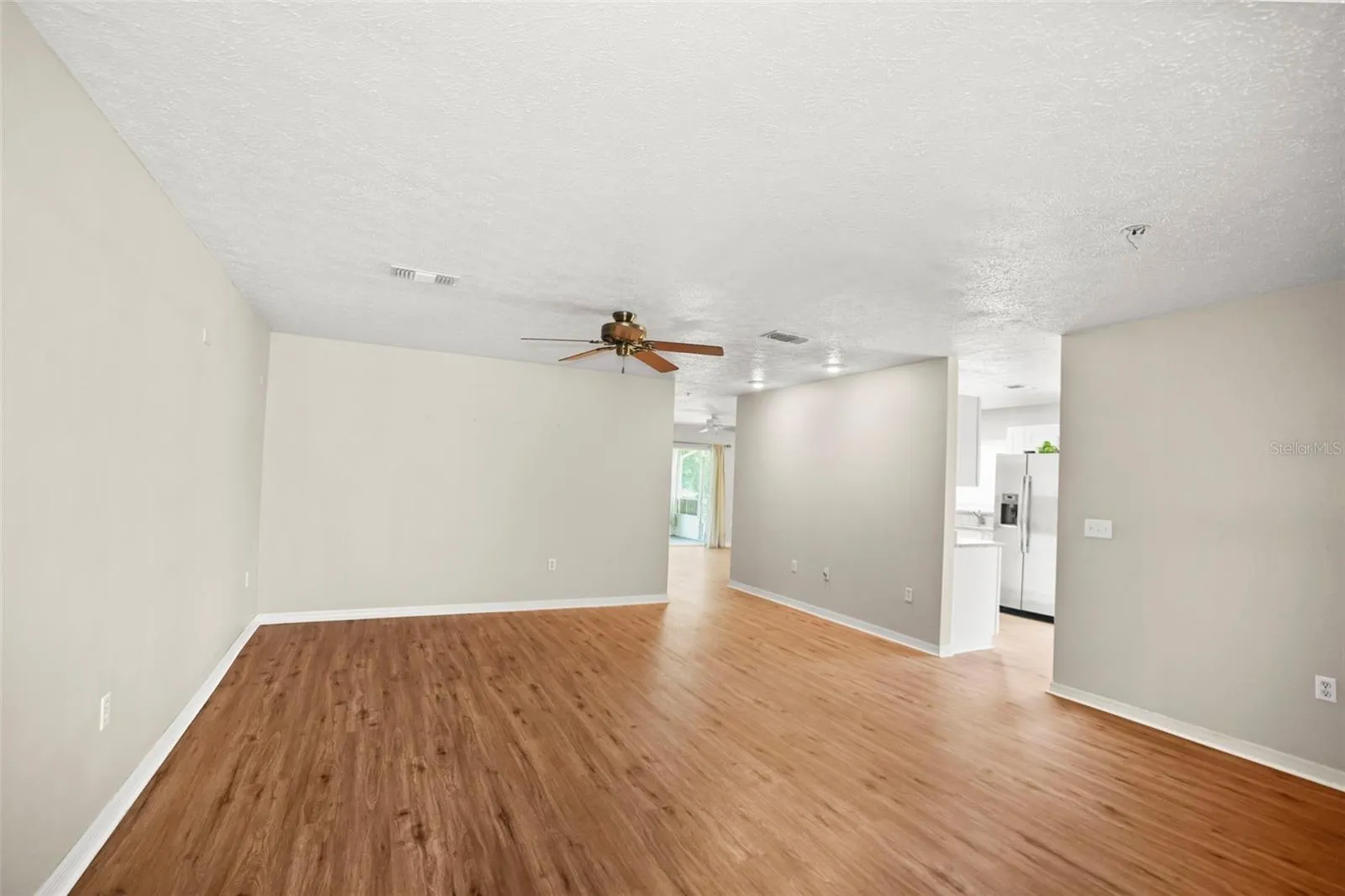 Spacious Livingroom from the front door with a view of the kitchen
