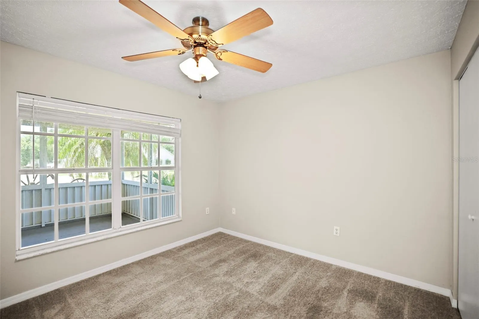 Bedroom 3 with large window that allows natural light and built in closet.