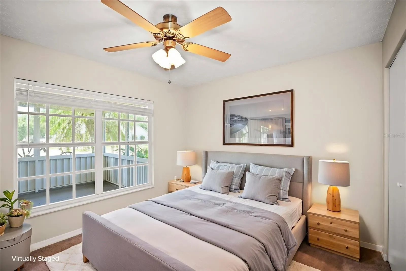 Bedroom 3 with built in closet and large window allowing natural light.