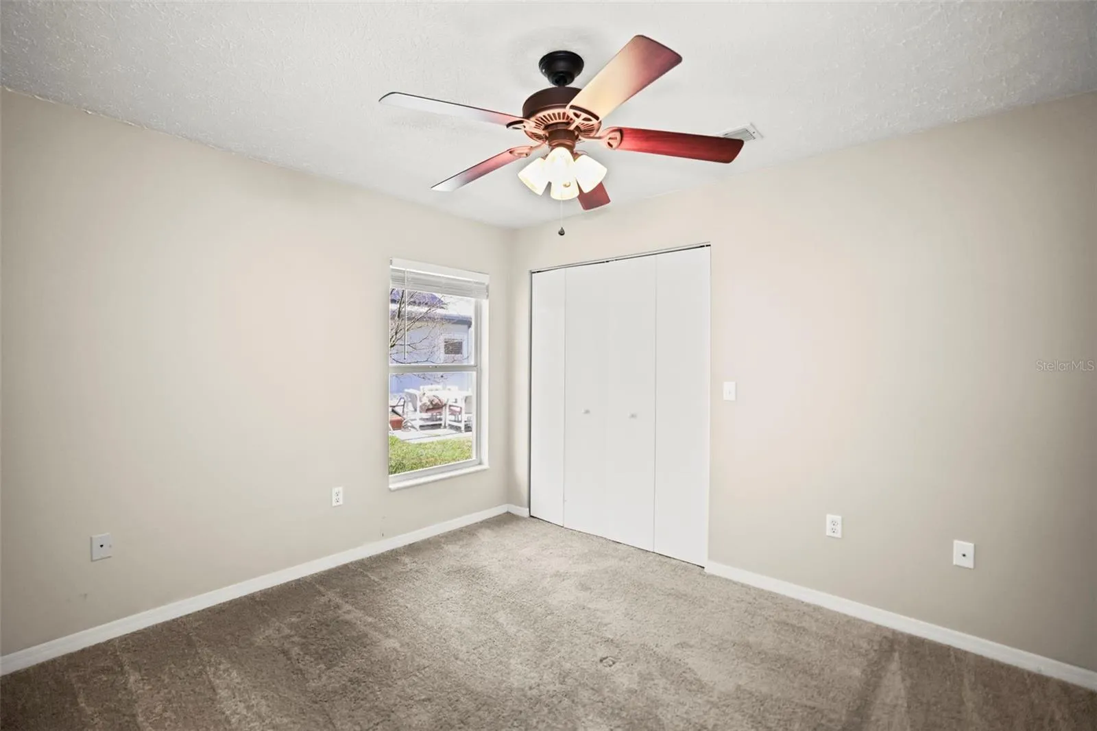 Bedroom 2 with carpeting and built in closet.