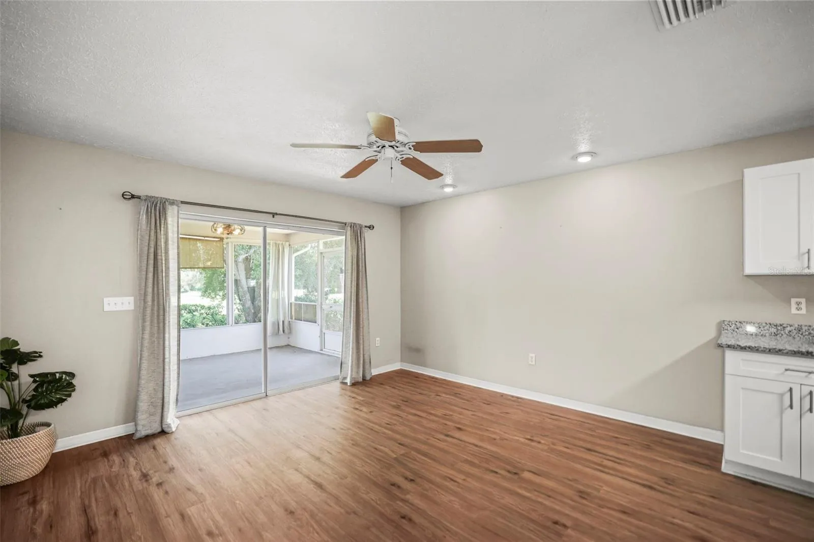 Diningroom with sliders leading to enclosed rear porch