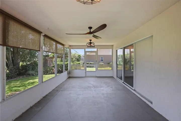 Enclosed rear porch with panoramic views of the golf course