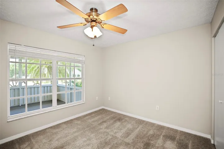 Bedroom 3 with large window that allows natural light and built in closet.