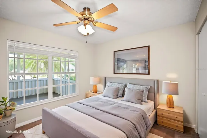 Bedroom 3 with built in closet and large window allowing natural light.