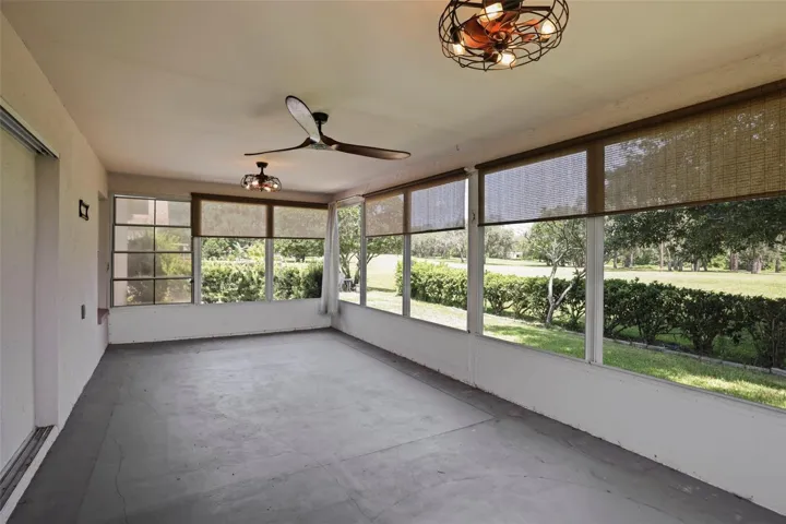 Enclosed rear porch with panoramic views of the golf course