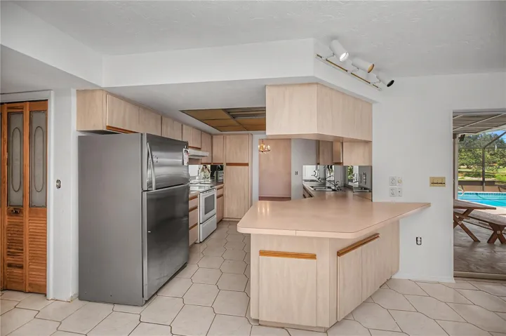 Kitchen opens to dinette and family room