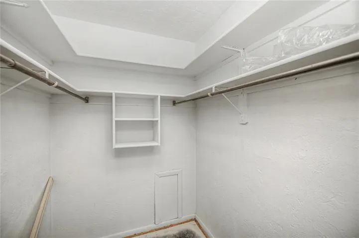 Primary bedroom walk-in closet