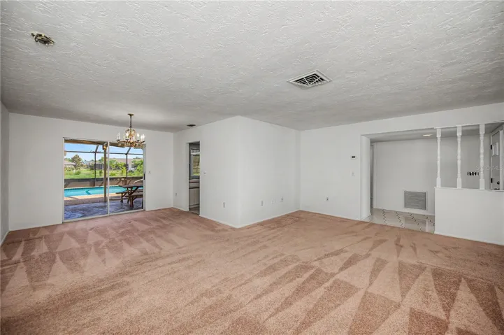 Living room/Dining room with pocket sliders to he lanai