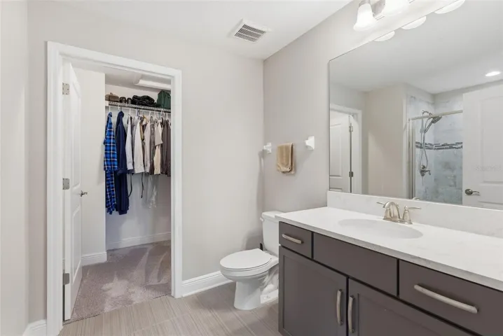 big closet attached to bathroom in primary room
