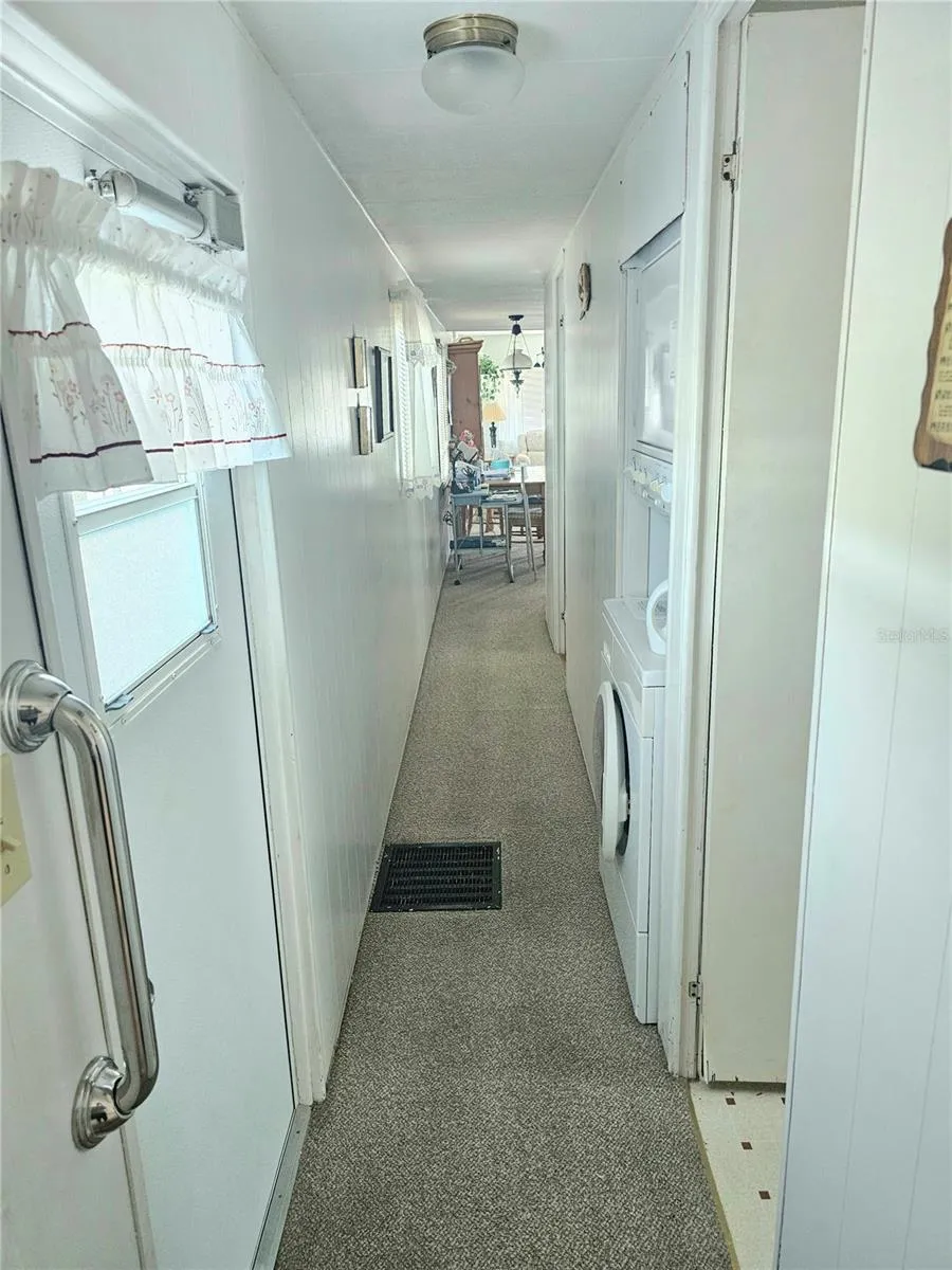 Hallway with stackable washer/dryer