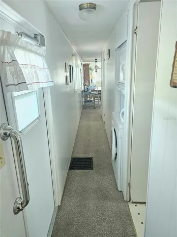 Hallway with stackable washer/dryer
