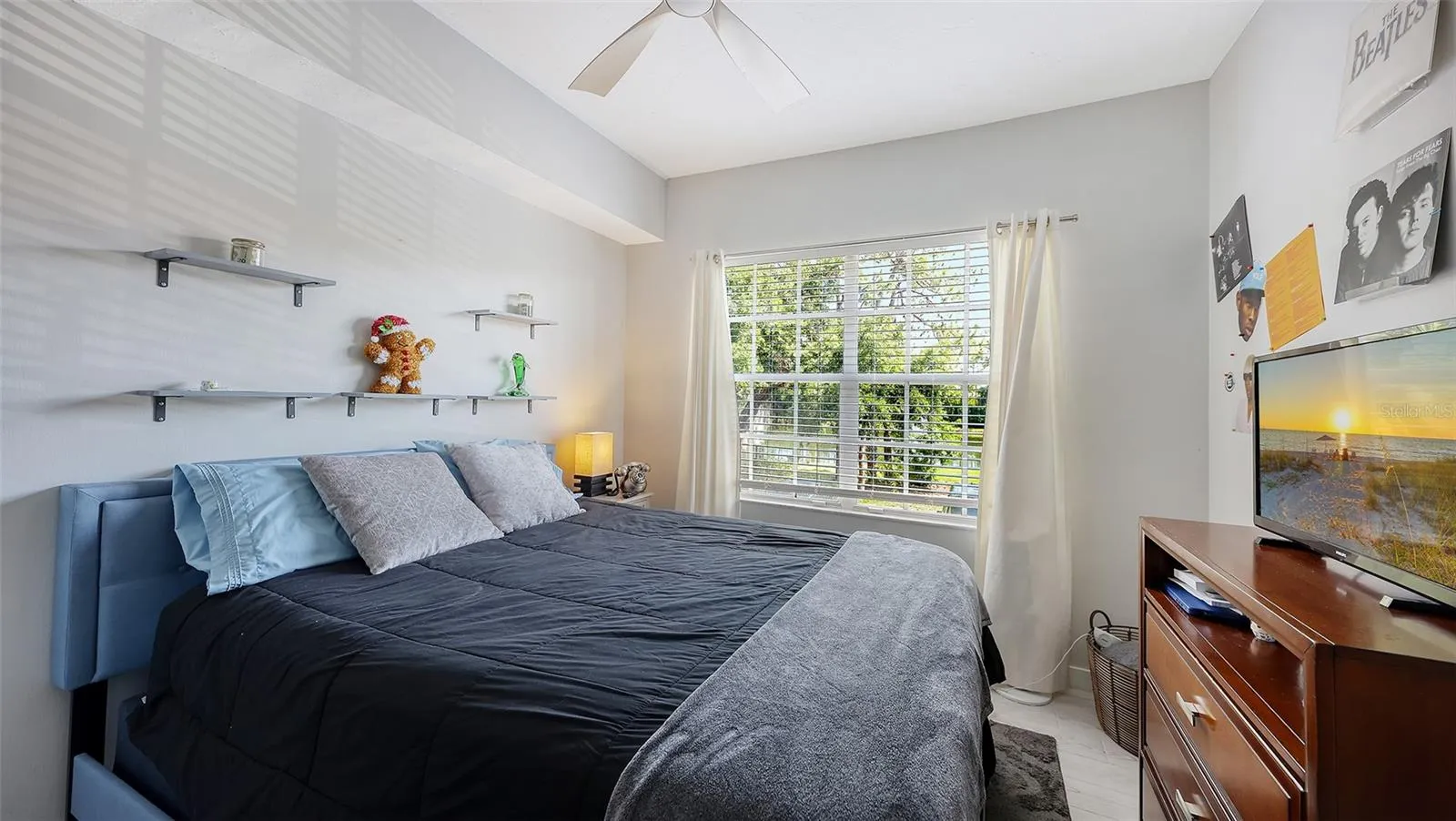 This bedroom is on the same floor as the kitchen and family room.