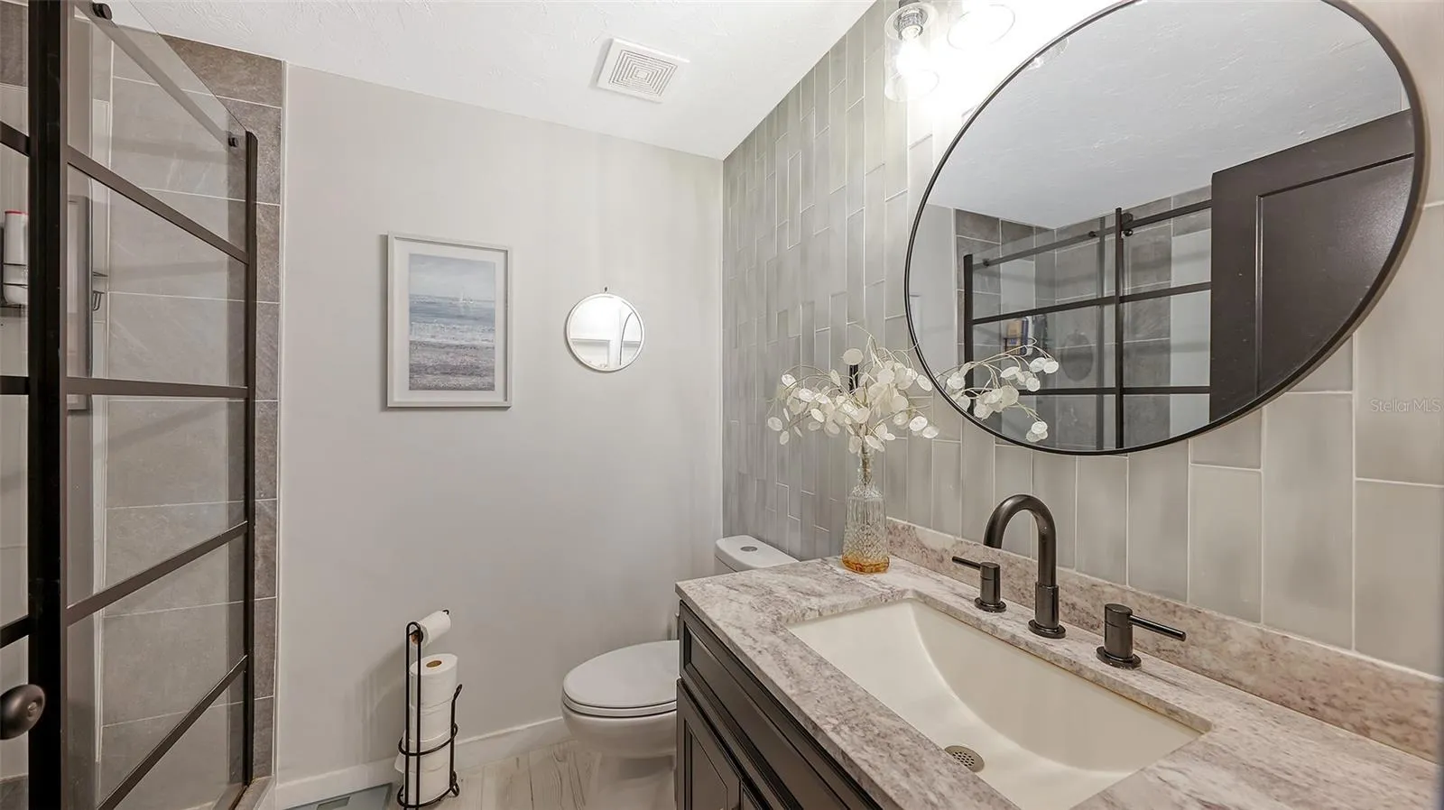 This fully renovated bath is on the same level as the kitchen and living area.