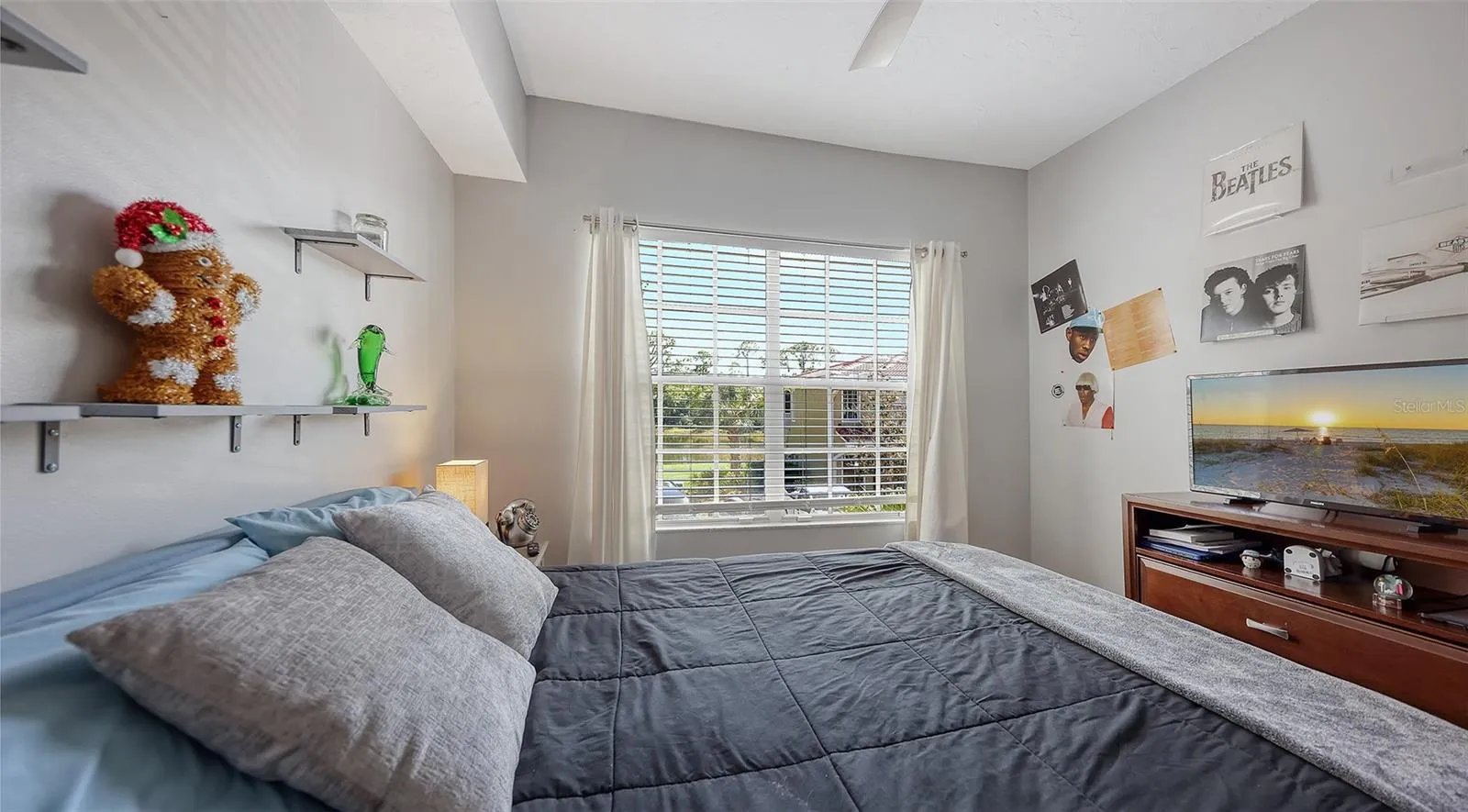 Lake views from this room with shelving in the closet.