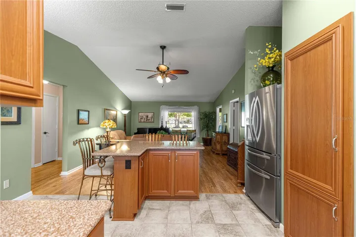 VIEW OF KITCHEN AND GREAT ROOM