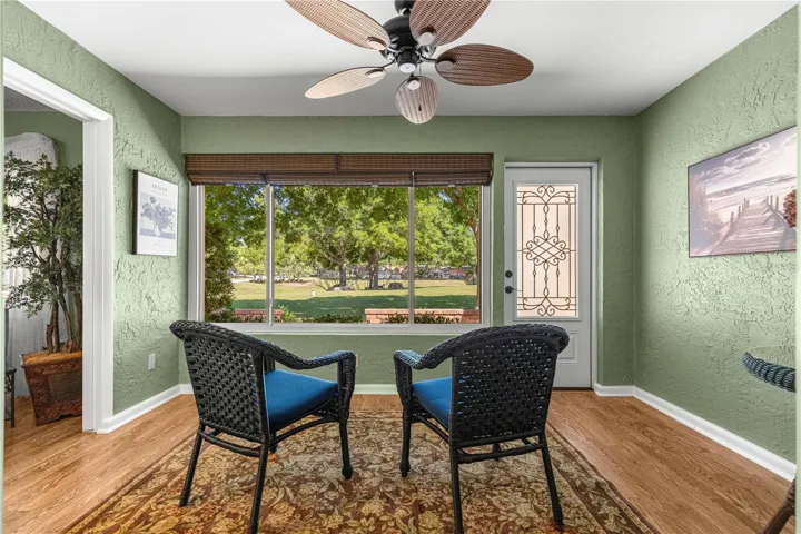 FLORIDA ROOM WITH A  VIEW AND EXIT TO PATIO