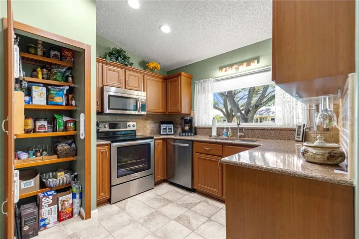 KITCHEN -  LARGE PANTRY WITH BUILT-IN SHELVES