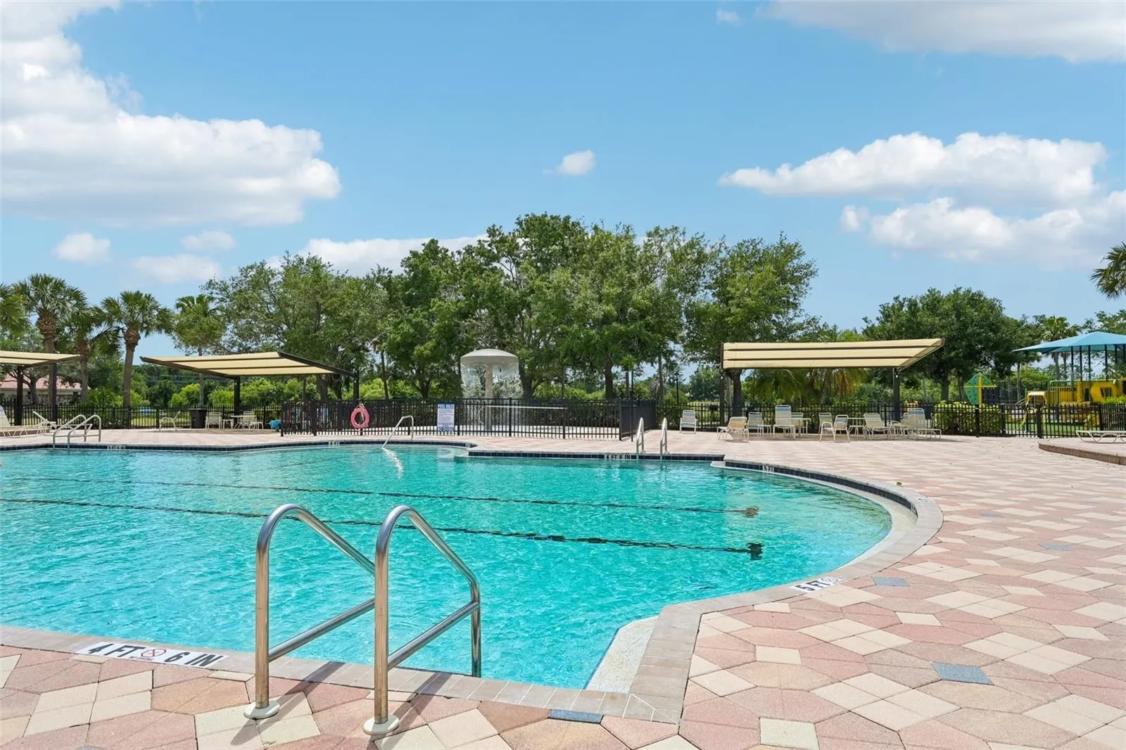 BEAUTIFUL HEATED POOL WITH SHADED LOUNGE SEATING