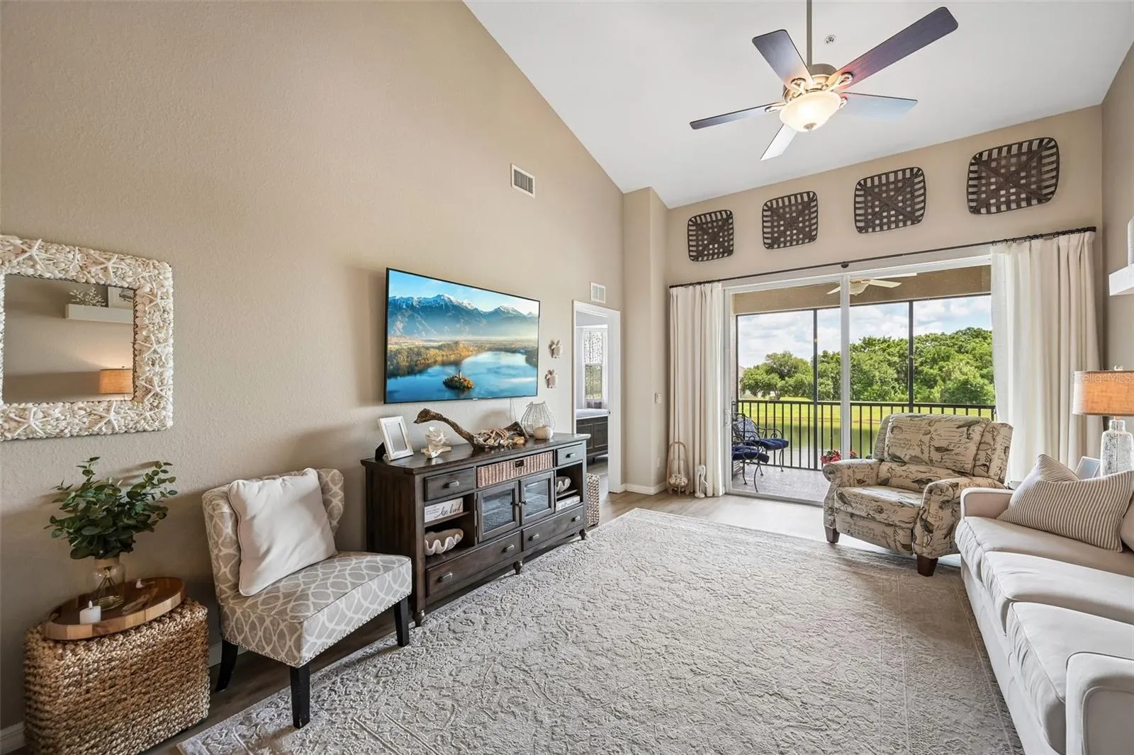 GREAT ROOM WITH BALCONY OVERLOOKING THE POND AND GOLF COURSE HOLE 16