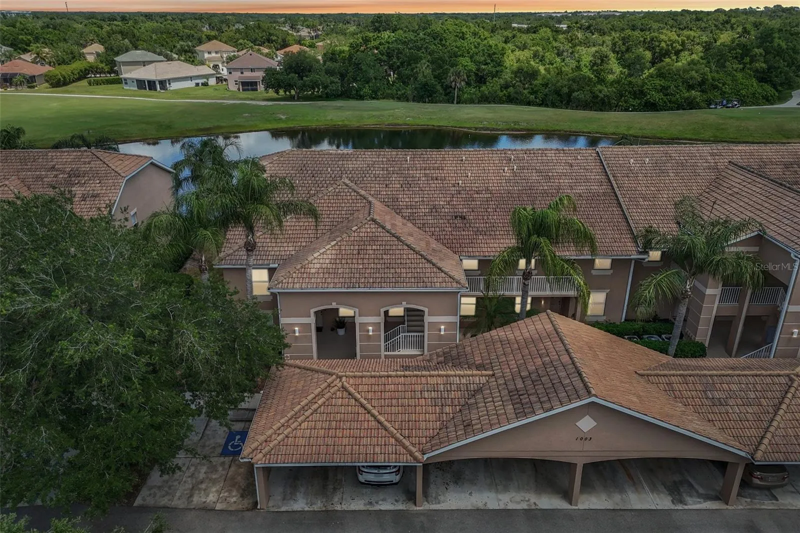 DRONE VIEW OVERLOOK THE FRONT AND BACK OF THE PROPERTY