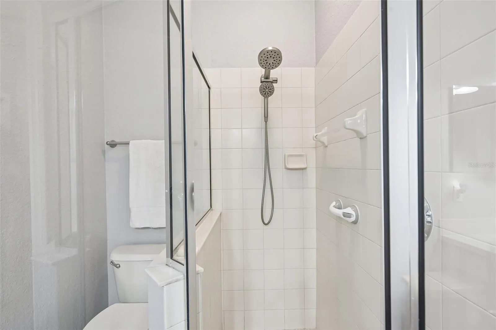 GLASS SHOWER IN PRIMARY BATHROOM