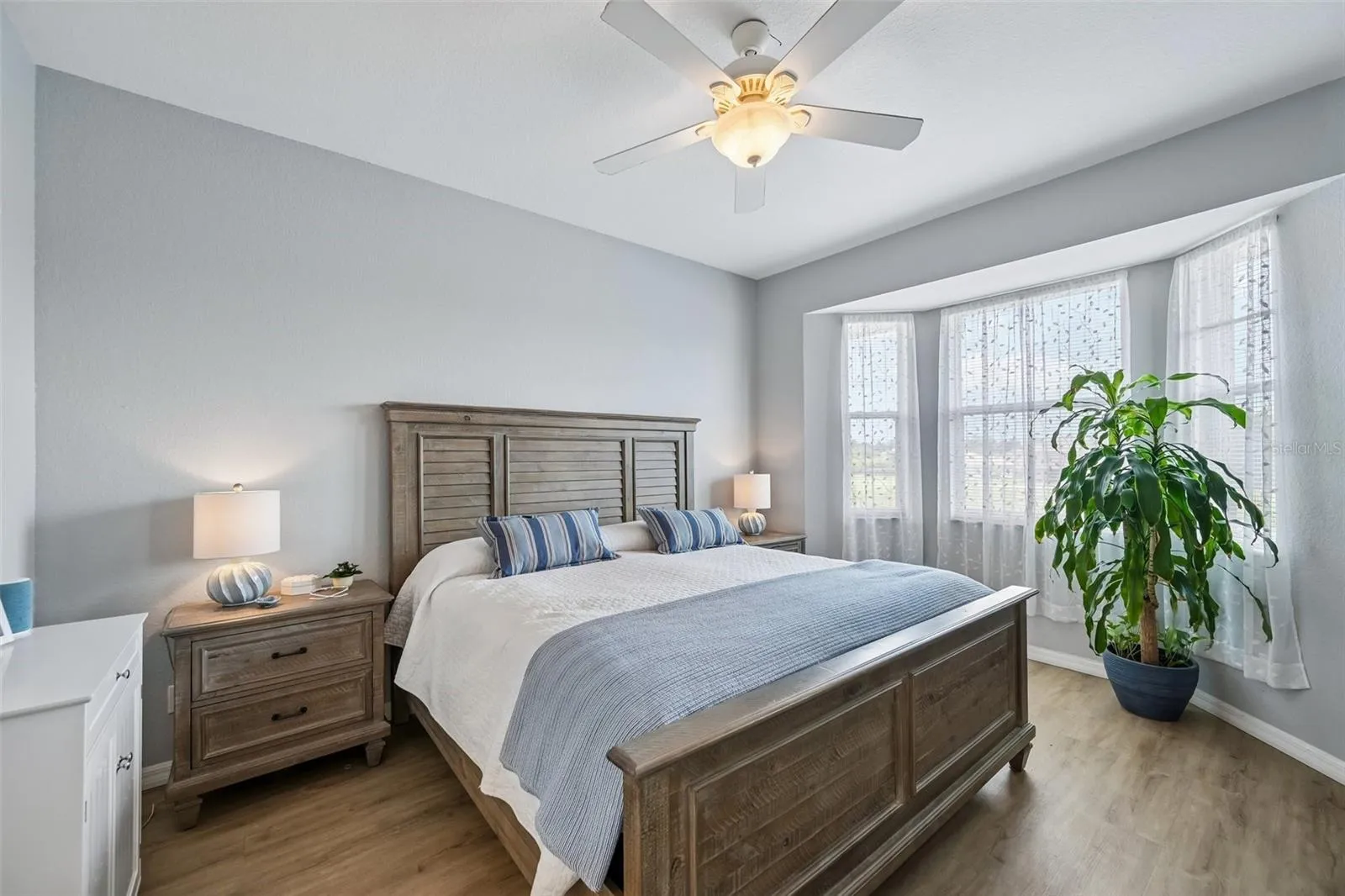 PRIMARY BEDROOM WITH BEAUTIFUL WINDOW OVERLOOKING THE BACK POND