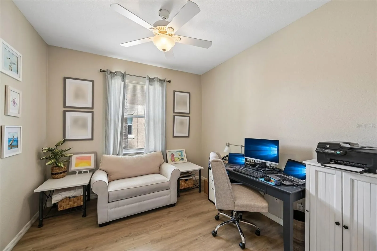 DEN OR OFFICE WITH A WINDOW OVERLOOKING THE FROUNT