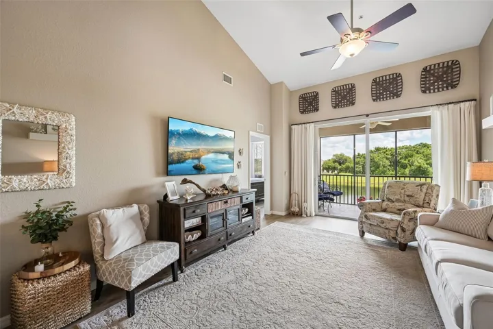 GREAT ROOM WITH BALCONY OVERLOOKING THE POND AND GOLF COURSE HOLE 16