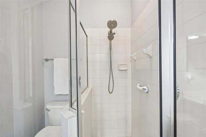 GLASS SHOWER IN PRIMARY BATHROOM