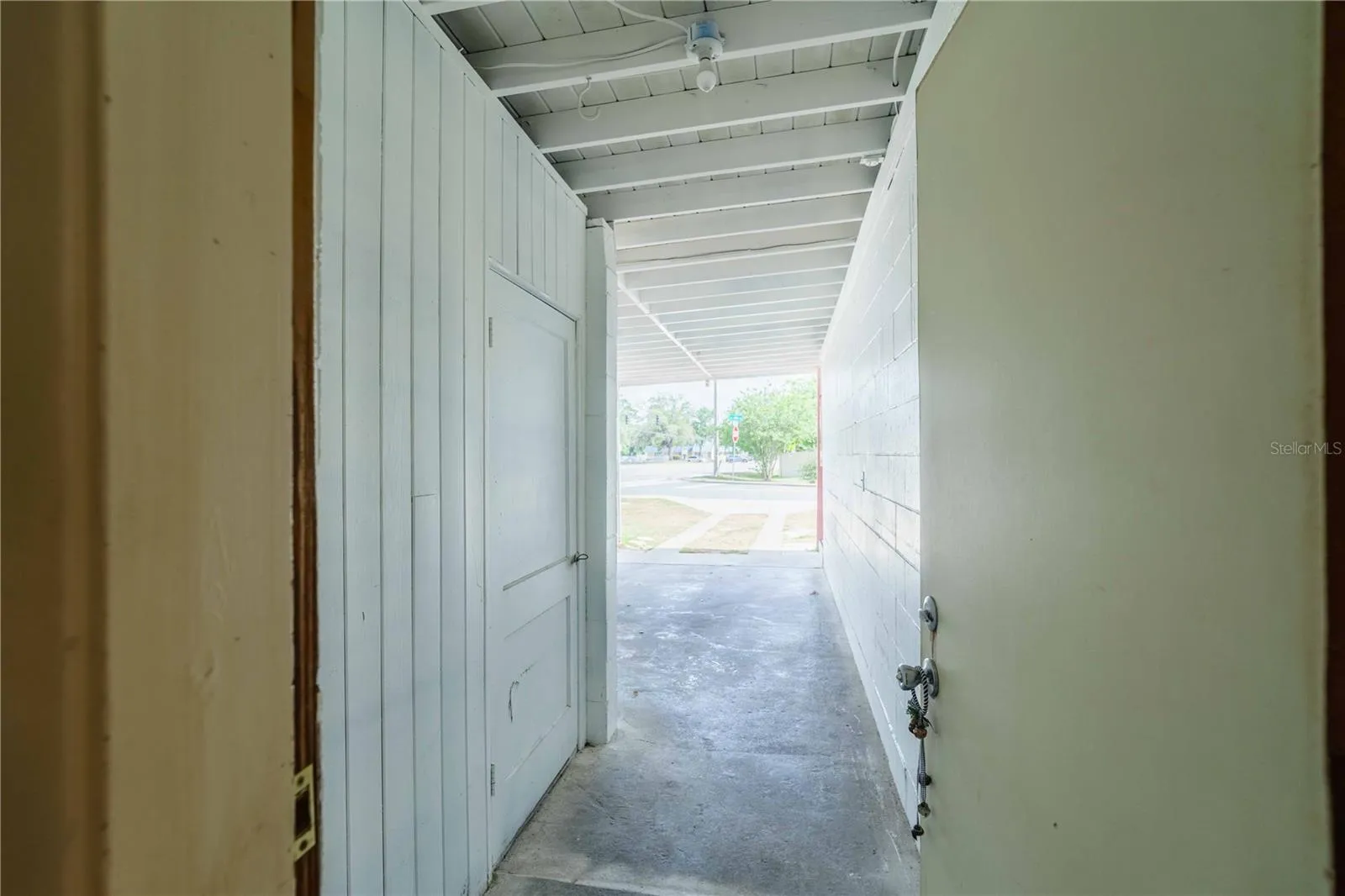 Entrance from bonus room to carport