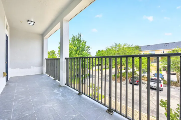 From the Dining area, step out through a glass-paneled door that opens to a PRIVATE BALCONY, offering a lovely spot to enjoy fresh air and quiet moments.