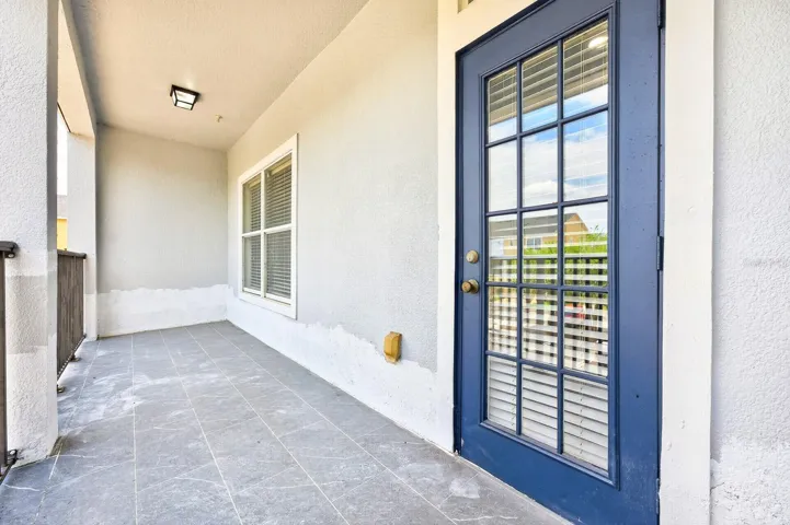 From the Dining area, step out through a glass-paneled door that opens to a PRIVATE BALCONY, offering a lovely spot to enjoy fresh air and quiet moments.