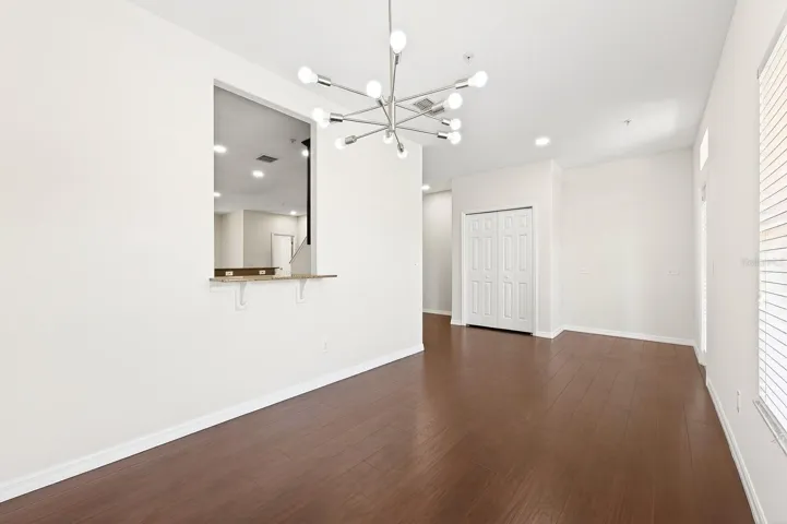 A pass-through window from the Kitchen to the Dining space adds function and creates a seamless flow for gatherings.