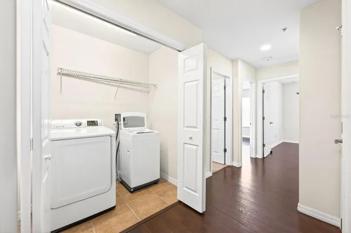 Two additional bedrooms, a full bath, and a convenient LAUNDRY CLOSET complete the upper level.