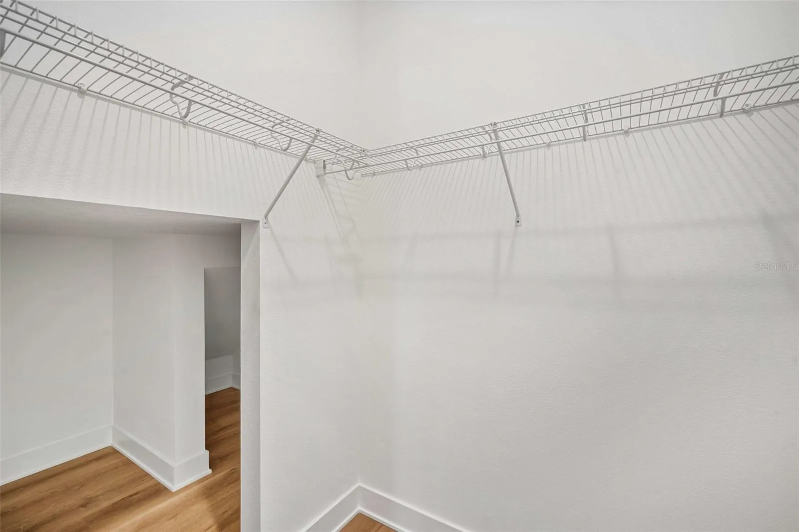 First floor bedroom closet that extends under staircase