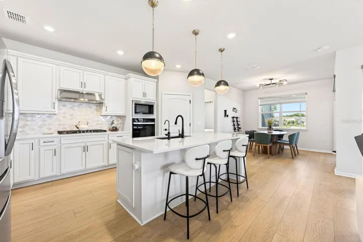 A generous center island offers extra prep space and room for counter-height seating.