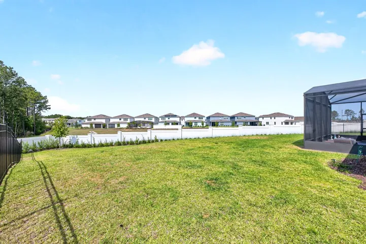 The generous backyard space is perfect for gatherings and weekend barbecues.