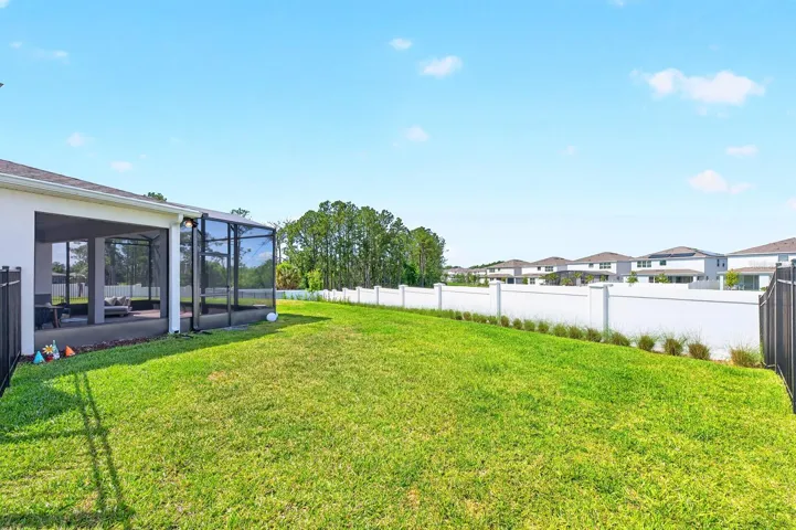 The generous backyard space is perfect for gatherings and weekend barbecues.