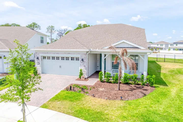 Welcome to this elegant and NEARLY NEW 4-bedroom, 3-bath home in the highly sought-after Del Webb Oasis of Winter Garden, a GUARD-GATED 55+ community where luxury, comfort, and lifestyle come together beautifully.