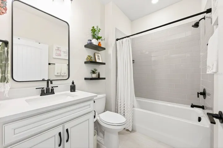 Also on the main level, you’ll find a secondary bedroom and full bath.