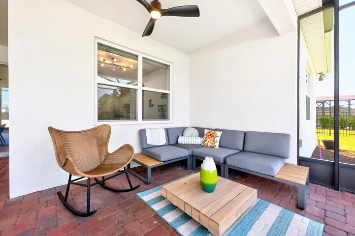 Step outside to your EXTENDED COVERED PAVER PATIO, complete with a SUMMER KITCHEN (2025) and set beneath an oversized screened lanai, all enhanced by CUSTOM OUTDOOR LIGHTING (2025)—perfect for entertaining or enjoying peaceful evenings at home.