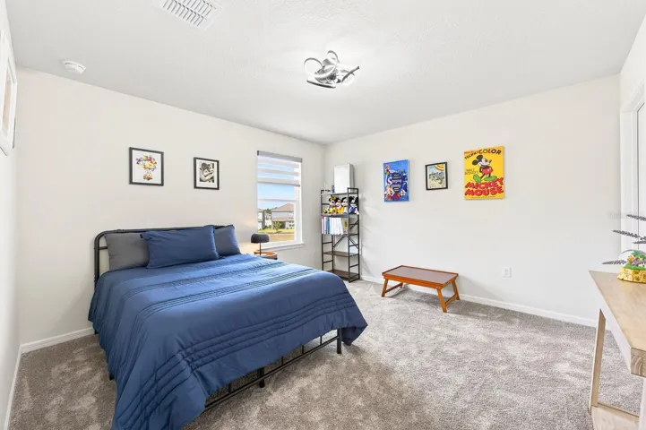 An ADDITIONAL BEDROOM AND FULL BATH upstairs provide the perfect setup for guests.