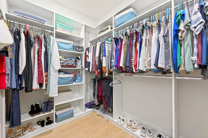 The Primary Suite's CUSTOM-DESIGNED WALK-IN CLOSET (2026).