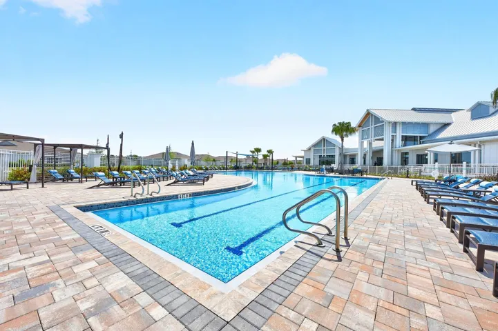 Residents of Del Webb Oasis enjoy RESORT-STYLE AMENITIES, including a clubhouse, sparkling pool, fitness center, tennis courts, and social activities, along with included cable and internet, fostering an active and connected lifestyle.