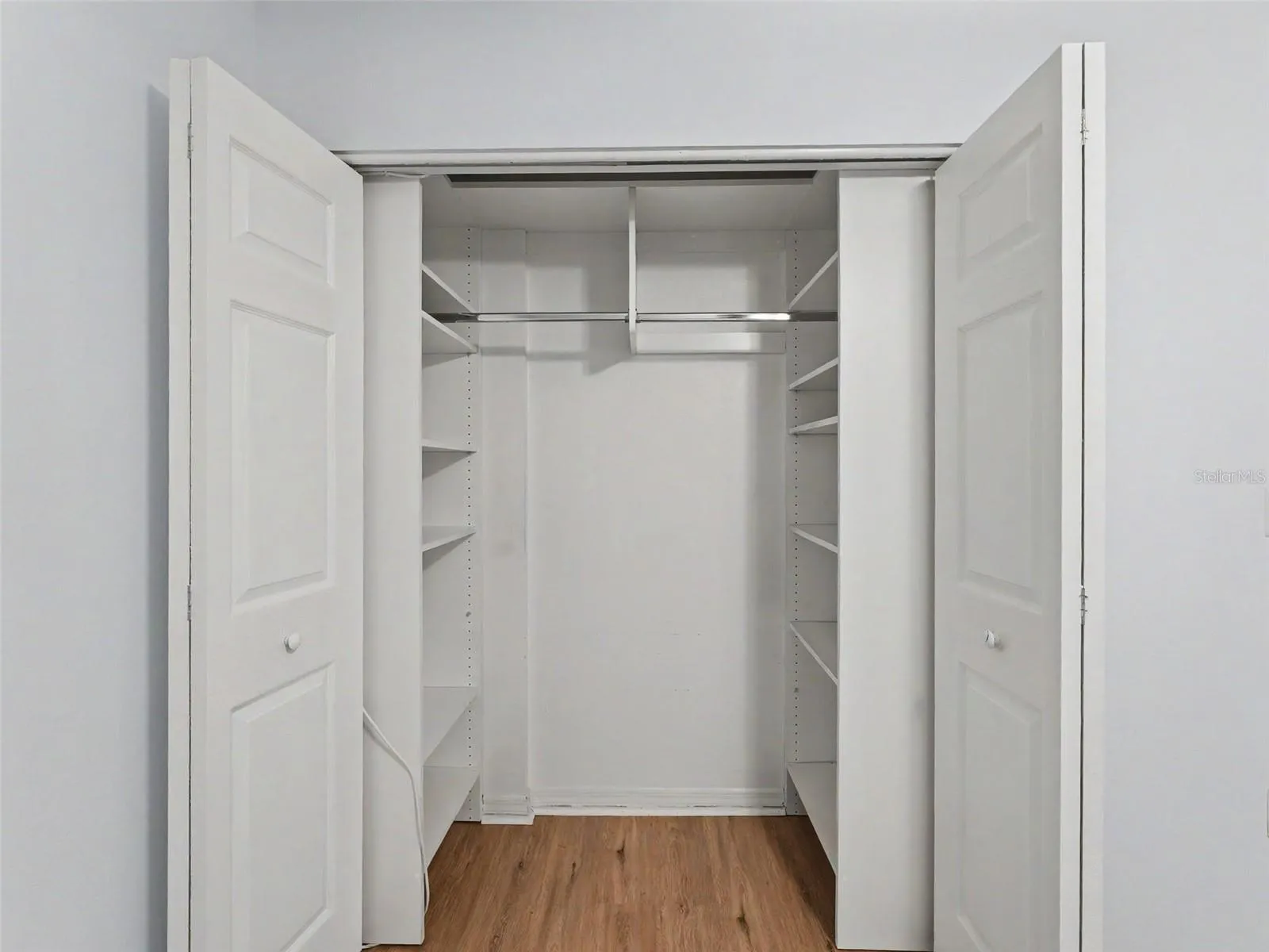 Custom closet organizers in both bedrooms