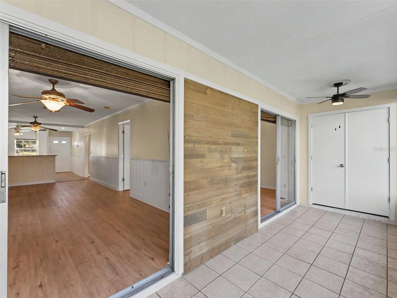 The enclosed porch has access from the primary bedroom and living room